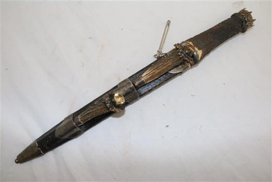 A George IV Scottish silver mounted stag horn and leather dirk, 18in.